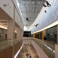 Architectural paper birds for decorations of the mall 
