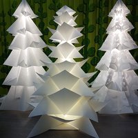 New Year decoration of store windows with designer Christmas trees 
